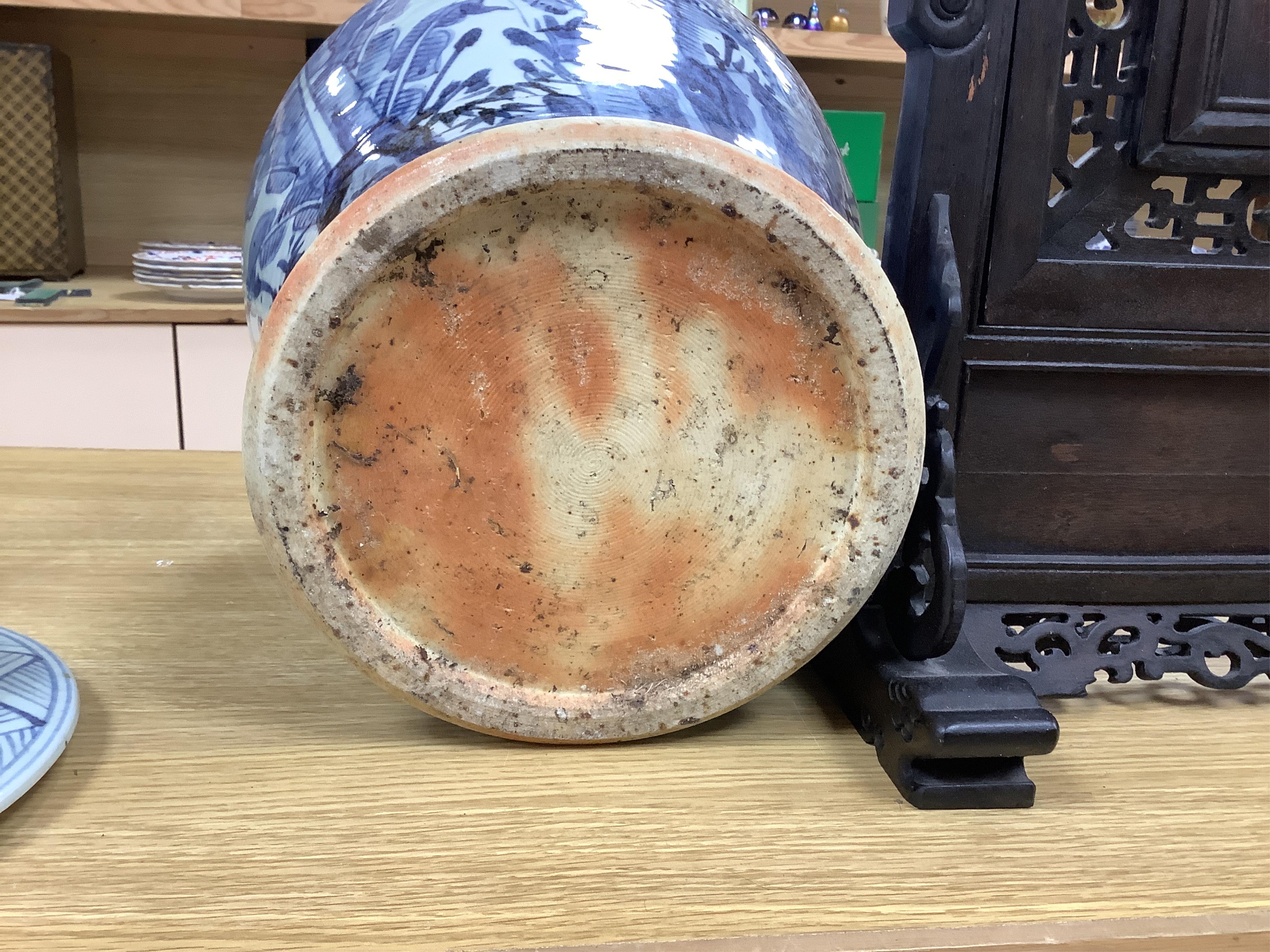 A pair of large Chinese blue and white ginger jars and covers, 54cm high. Condition - fair to good